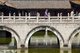 China: Bridge leading to the octagonal Qing-era pavilion, Yuantong Si (Yuantong Temple), Kunming, Yunnan Province